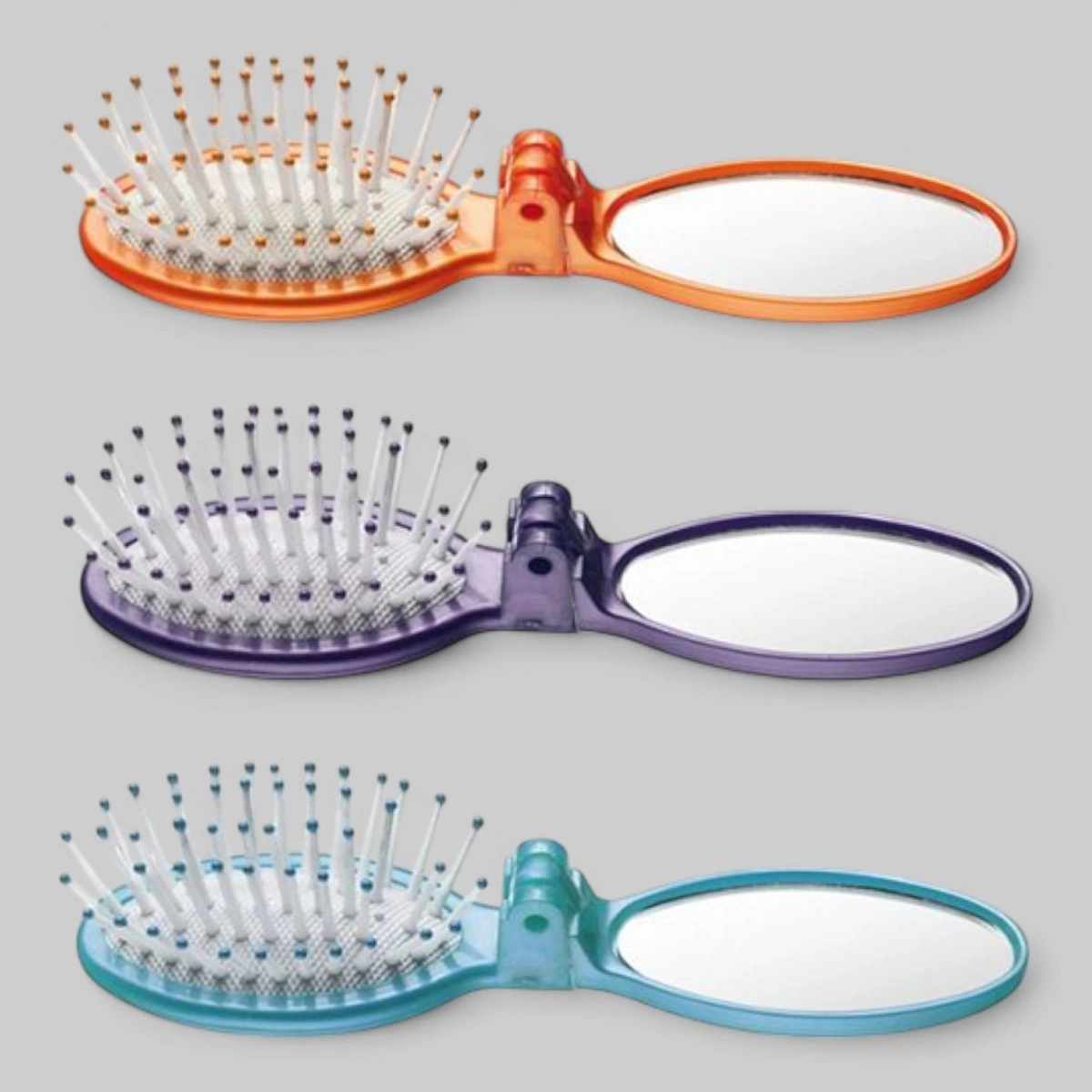 Массажка мини со складывающимся зеркальцем, пластиковые зубья на резиновой основе. овальная 5 рядов